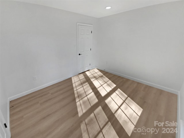 unfurnished room featuring light hardwood / wood-style flooring