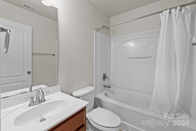 full bathroom featuring toilet, vanity, and shower / tub combo with curtain