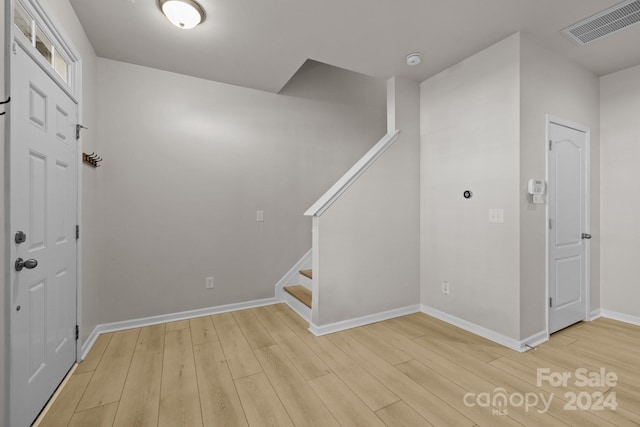 entryway with light hardwood / wood-style floors