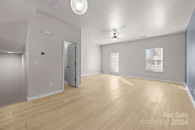 unfurnished room featuring ceiling fan and light hardwood / wood-style floors