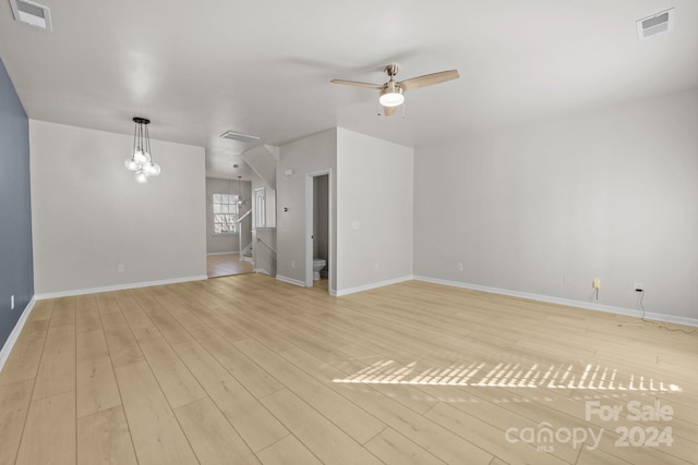 unfurnished living room with ceiling fan and light wood-type flooring