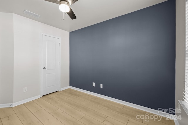 unfurnished room featuring ceiling fan and light wood-type flooring