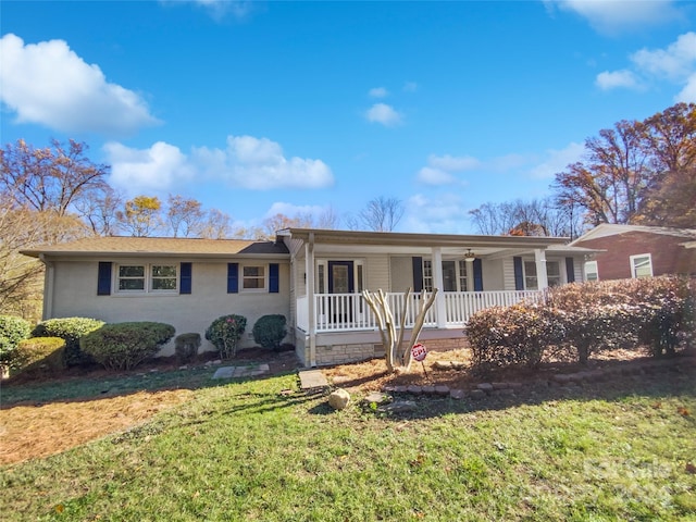 single story home featuring a porch and a front yard