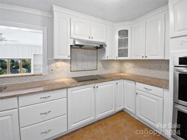 kitchen featuring ceiling fan, stone countertops, white cabinetry, and black electric cooktop