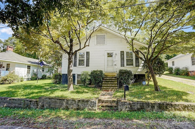 view of front of property with a front lawn