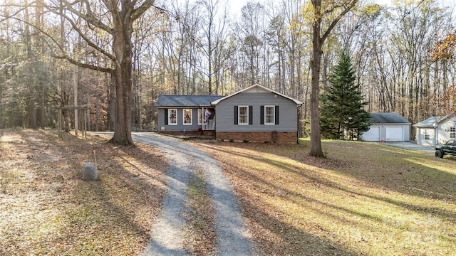 ranch-style house with an outbuilding and a garage