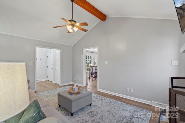 living room featuring ceiling fan, wood-type flooring, beamed ceiling, and high vaulted ceiling