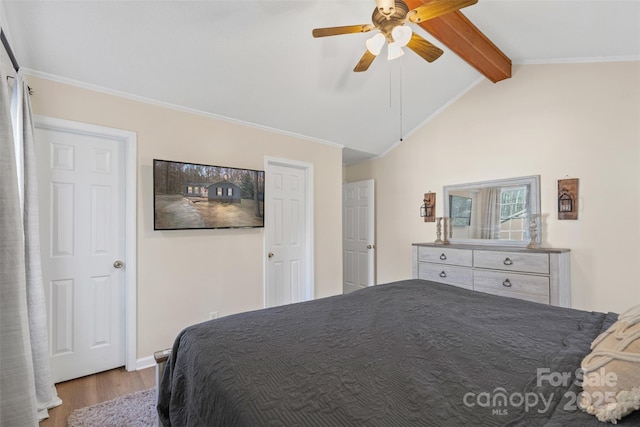 bedroom with ceiling fan, light wood-type flooring, and vaulted ceiling with beams