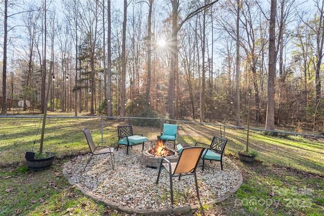 view of yard with an outdoor fire pit