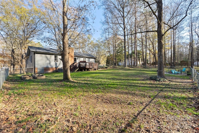 view of yard with a deck