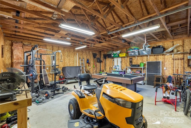 garage featuring wood walls