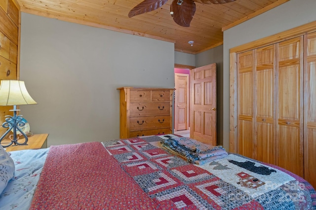 bedroom featuring a closet, ceiling fan, and wooden ceiling