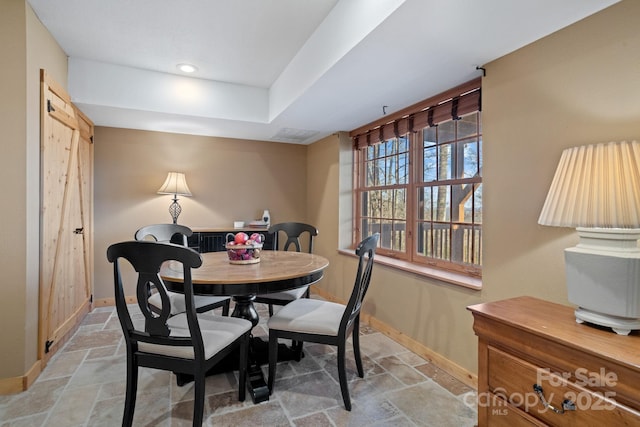 dining area with a barn door