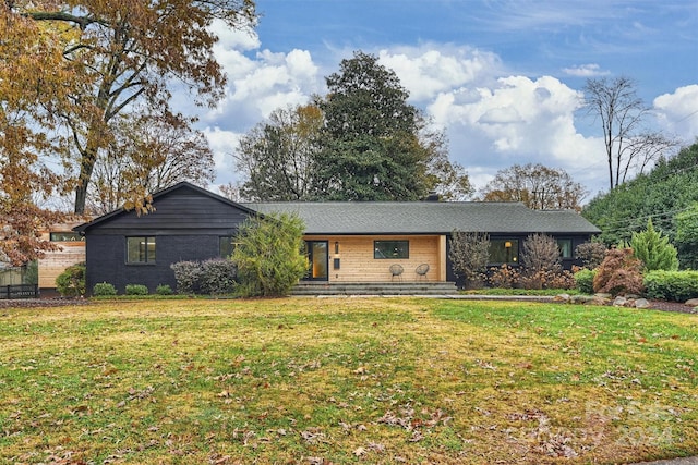 ranch-style house with a front yard