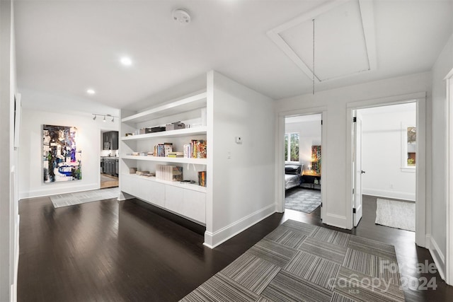 hallway with dark wood-type flooring