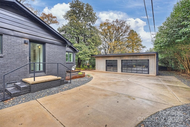 view of side of property featuring an outdoor structure and a garage