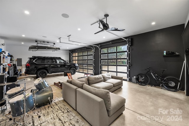 garage featuring electric panel and a wall mounted AC