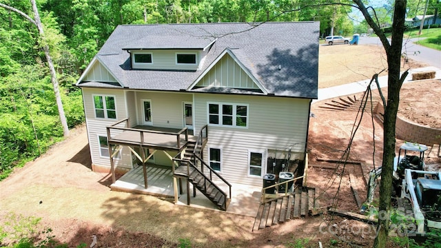 back of house featuring a deck