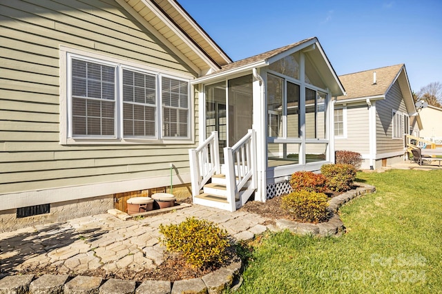 exterior space featuring a lawn and a patio area