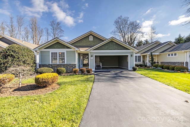 craftsman inspired home featuring a front lawn and a garage