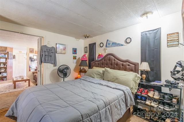 carpeted bedroom with a textured ceiling