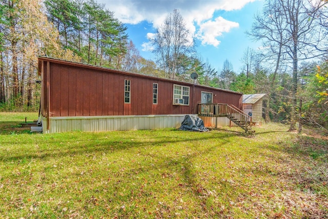 back of property featuring a lawn