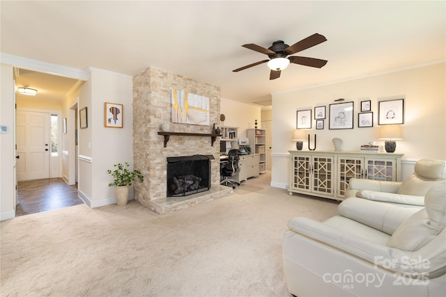 5431 Park Rd, Charlotte, NC 28209 - living room featuring a fireplace, carpet flooring, ornamental molding, and ceiling fan