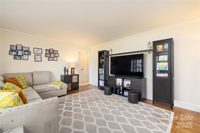5431 Park Rd, Charlotte, NC 28209 - living room with baseboards, crown molding, and wood finished floors
