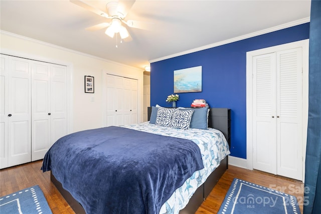 5431 Park Rd, Charlotte, NC 28209 - bedroom with a ceiling fan, ornamental molding, wood finished floors, multiple closets, and baseboards