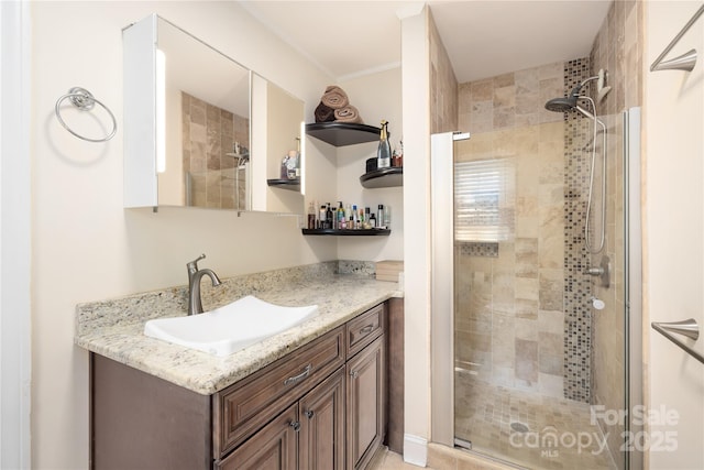 5431 Park Rd, Charlotte, NC 28209 - full bath featuring vanity, ornamental molding, and a stall shower
