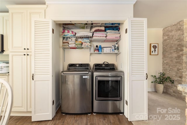 5431 Park Rd, Charlotte, NC 28209 - washroom featuring ornamental molding, wood finished floors, washer and dryer, and laundry area