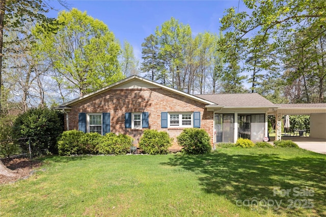 5431 Park Rd, Charlotte, NC 28209 - ranch-style house featuring fence, an attached carport, a front lawn, and brick siding