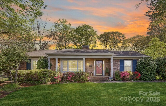 5431 Park Rd, Charlotte, NC 28209 - ranch-style house featuring roof with shingles, a front yard, brick siding, and a chimney