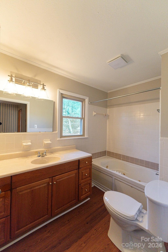 full bathroom with vanity, crown molding, wood-type flooring, shower / tub combination, and toilet