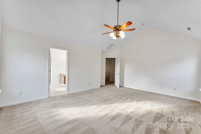 unfurnished room with ceiling fan, high vaulted ceiling, and light colored carpet