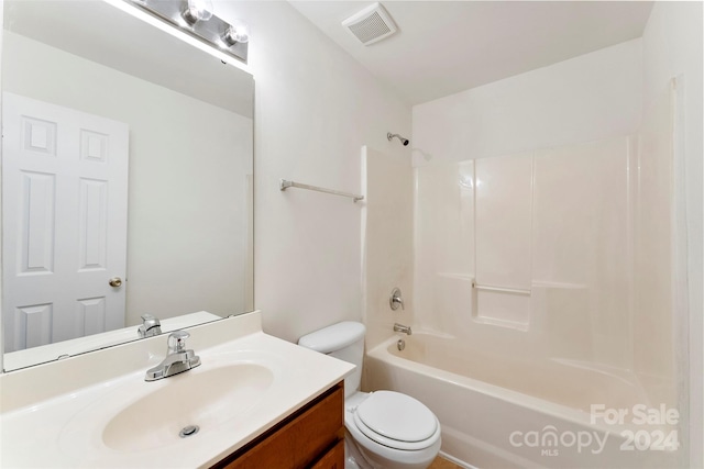 full bathroom featuring vanity, toilet, and shower / washtub combination