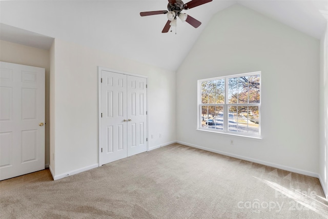 1805 Lexington Ave, Monroe, NC 28112 - unfurnished bedroom featuring high vaulted ceiling, carpet flooring, a closet, baseboards, and a ceiling fan
