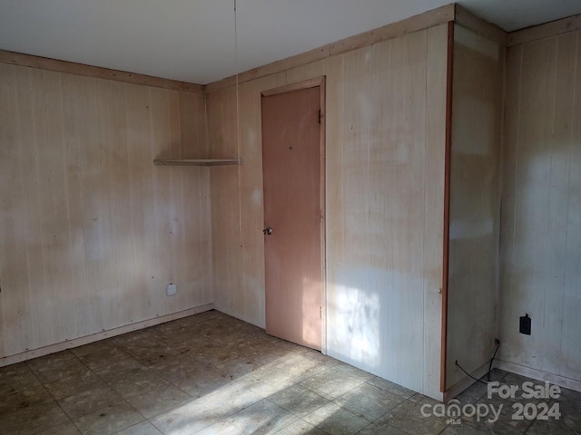 empty room with wood walls