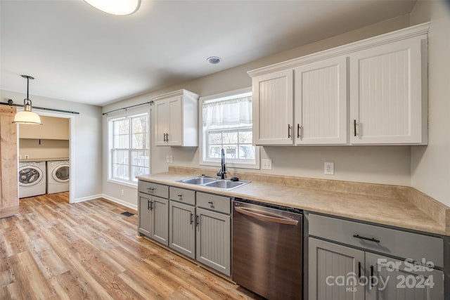 kitchen with dishwasher, sink, separate washer and dryer, light hardwood / wood-style flooring, and white cabinets