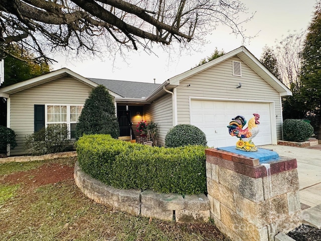 8430 Stoneman Pl, Charlotte, NC 28217 - ranch-style home with a garage, driveway, and a shingled roof