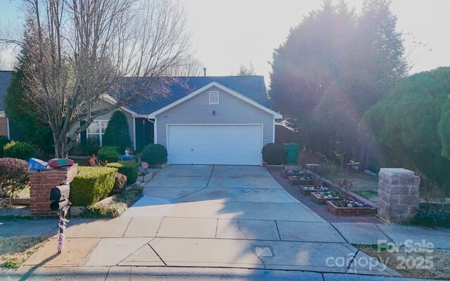 8430 Stoneman Pl, Charlotte, NC 28217 - view of front facade featuring a garage and concrete driveway
