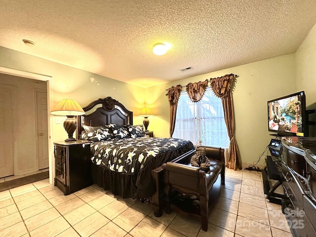 8430 Stoneman Pl, Charlotte, NC 28217 - bedroom with visible vents, a textured ceiling, and light tile patterned flooring