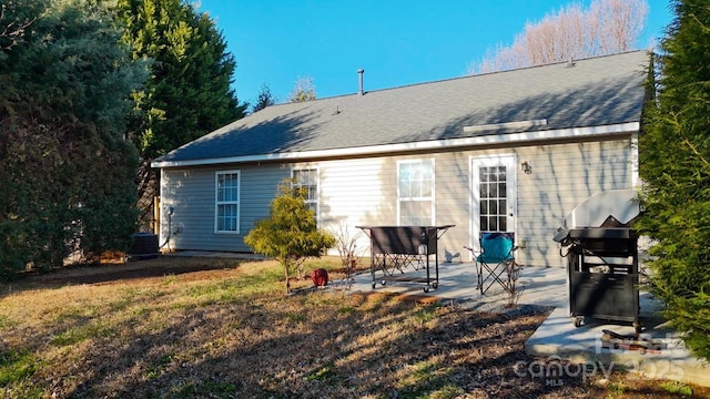8430 Stoneman Pl, Charlotte, NC 28217 - back of house featuring a shingled roof and a patio