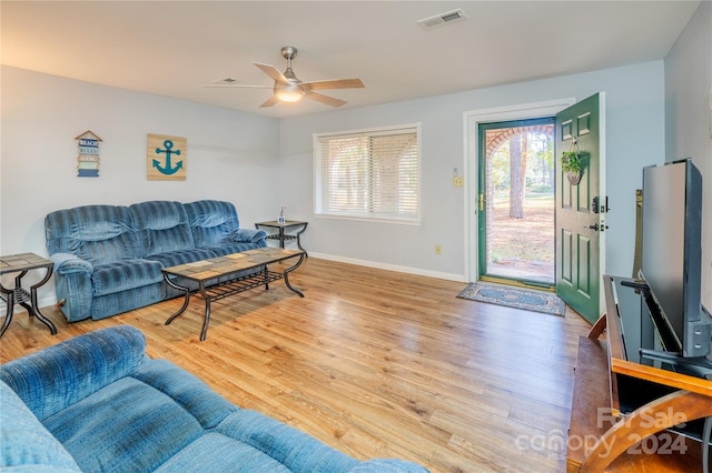 living room with ceiling fan and hardwood / wood-style flooring