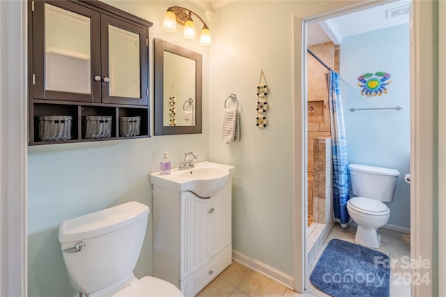 bathroom with tile patterned flooring, vanity, curtained shower, and toilet