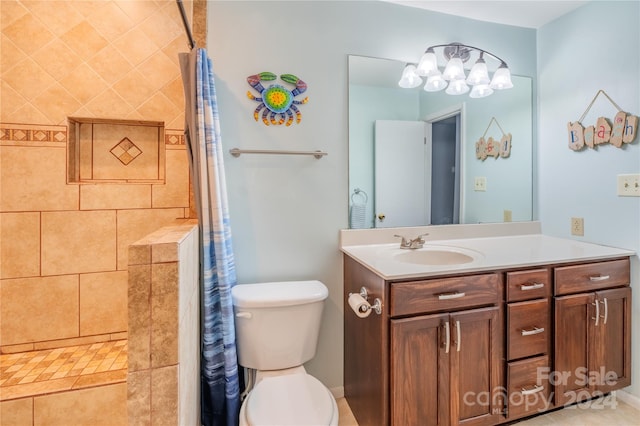 bathroom featuring a tile shower, tile patterned flooring, vanity, and toilet