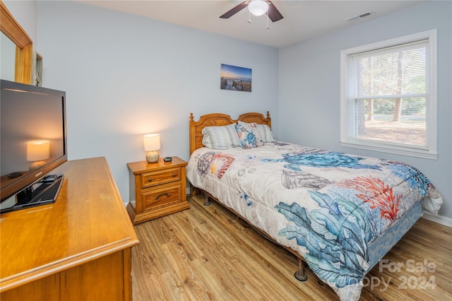 bedroom featuring light wood-type flooring and ceiling fan