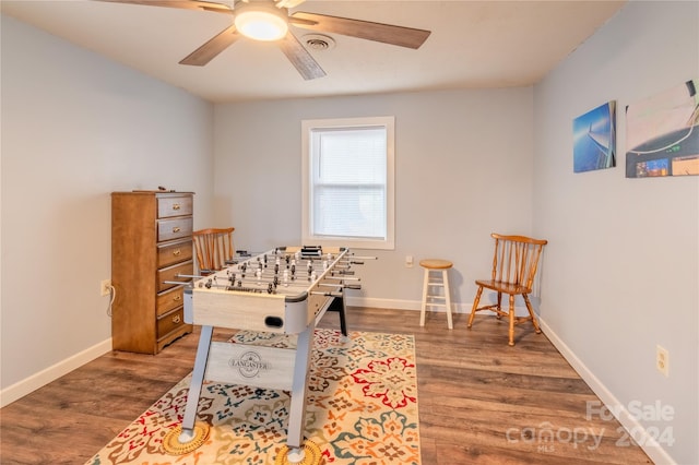 game room featuring hardwood / wood-style flooring and ceiling fan