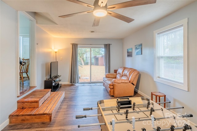 sitting room featuring dark hardwood / wood-style floors and ceiling fan