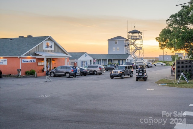 view of parking at dusk